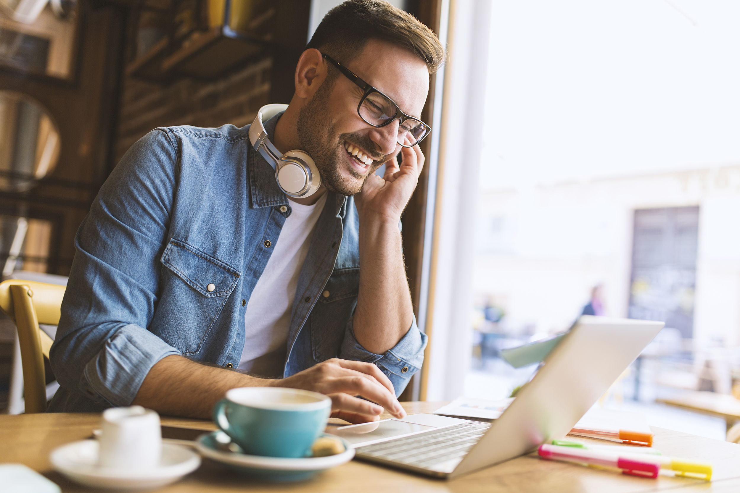 Man With a Coffee and a Laptop.jpg