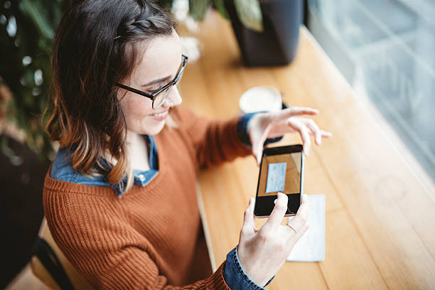 Woman Depositing a Cheque with a Smart Phone.jpg